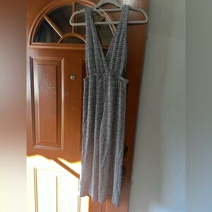 Black and white medium jump suit with side cut outs.